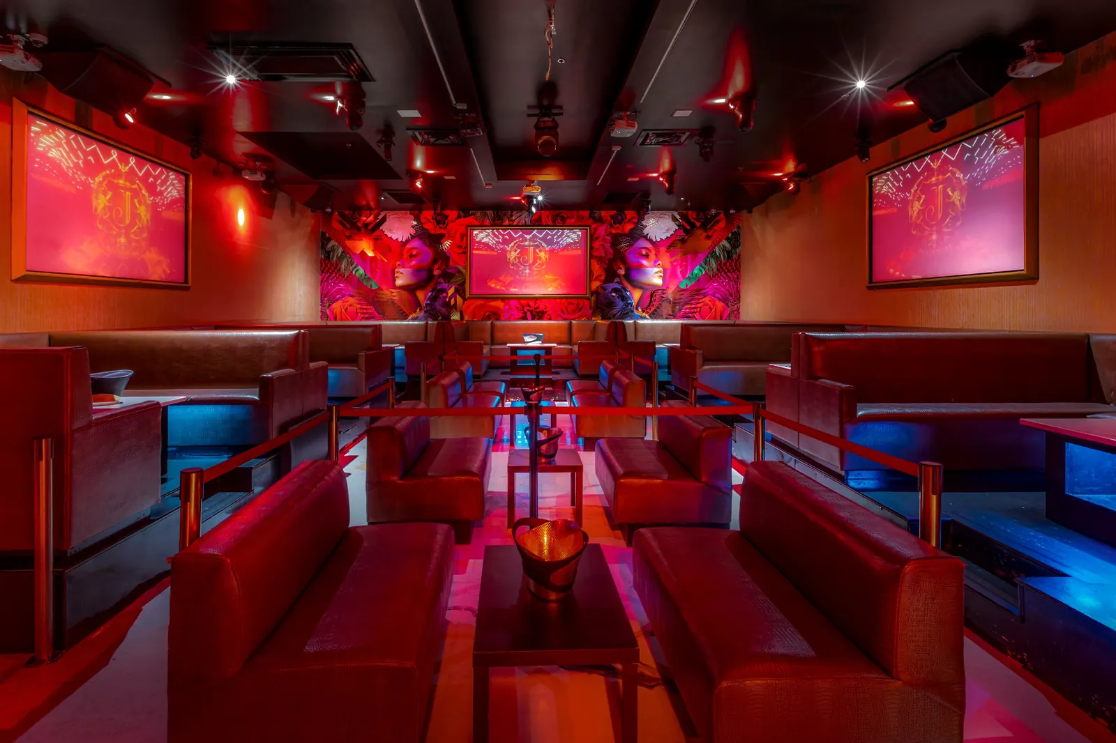 Josephine Lounge’s red seating and signature mural, a setting for celebrations in Atlanta
